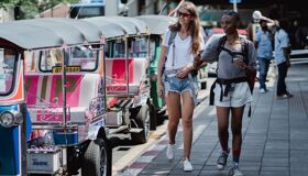 Tourists walking on the street in Thailand